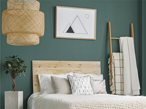 Dark green painted bedroom idea